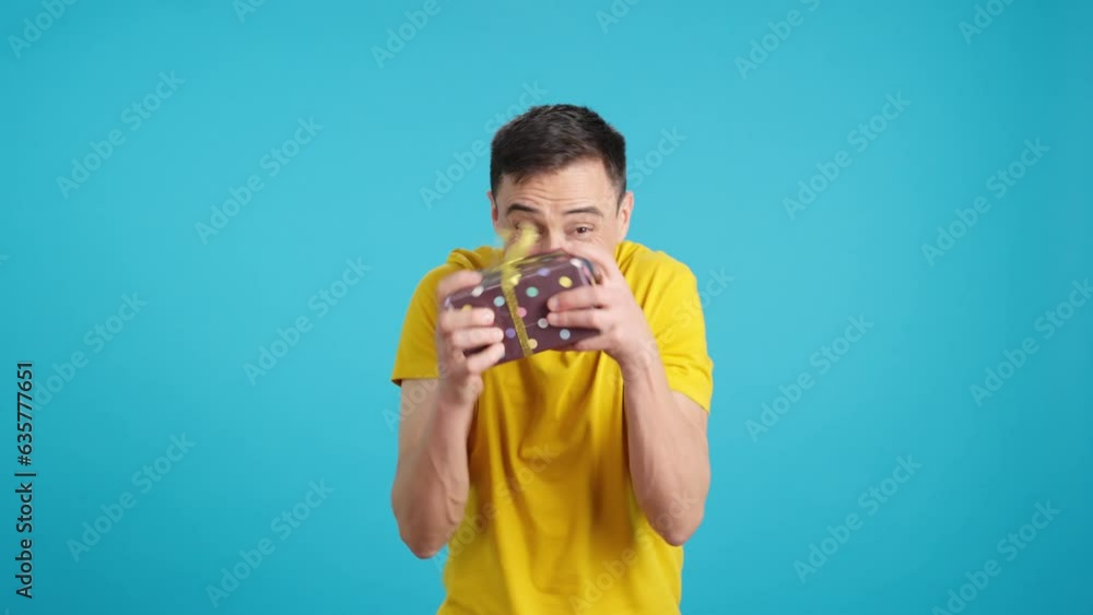 Happy man receiving a gift that he loves Happy man receiving a gift that he loves