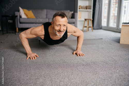 Active Senior Man Doing Yoga in His Apartment