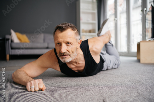 Active Senior Man Stretching in His Home