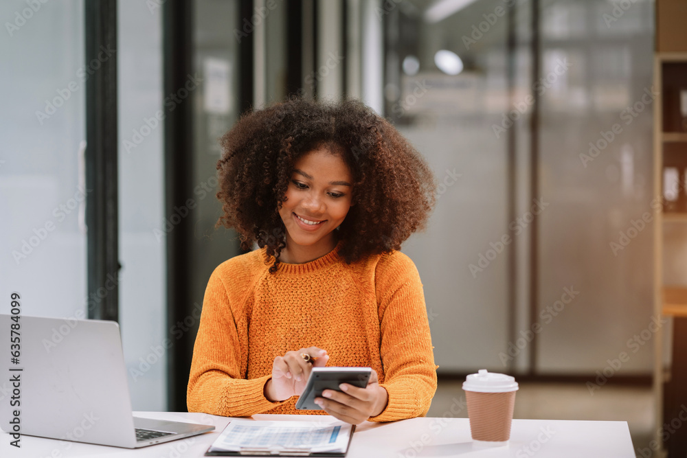 Business women are calculating income-expenditure and analyzing investment data at office, Accounting Financial and systems concept. Business women are calculating income-expenditure and analyzing investment data at office, Accounting Financial and systems concept.
