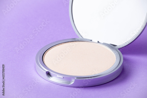 Eyeshadow palette on purple background in macro. Makeup product