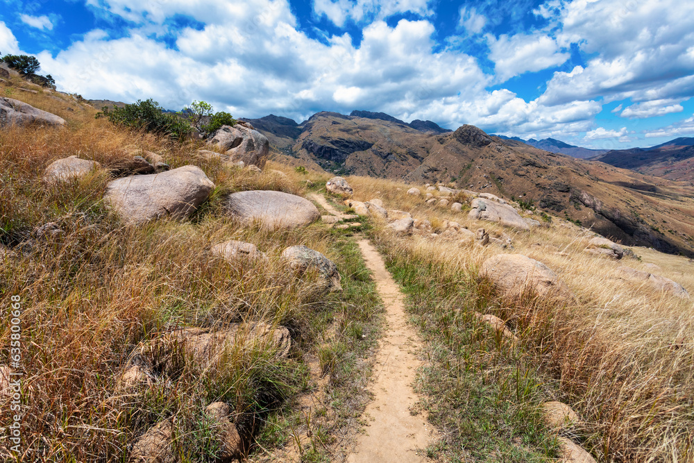 Andringitra national park, Haute Matsiatra region, Madagascar, beautiful mountain landscape with river in valley. Hiking in Andringitra mountains. Sunny day. Madagascar wilderness mountain landscape. Andringitra national park, Haute Matsiatra region, Madagascar, beautiful mountain landscape with river in valley. Hiking in Andringitra mountains. Sunny day. Madagascar wilderness mountain landscape.