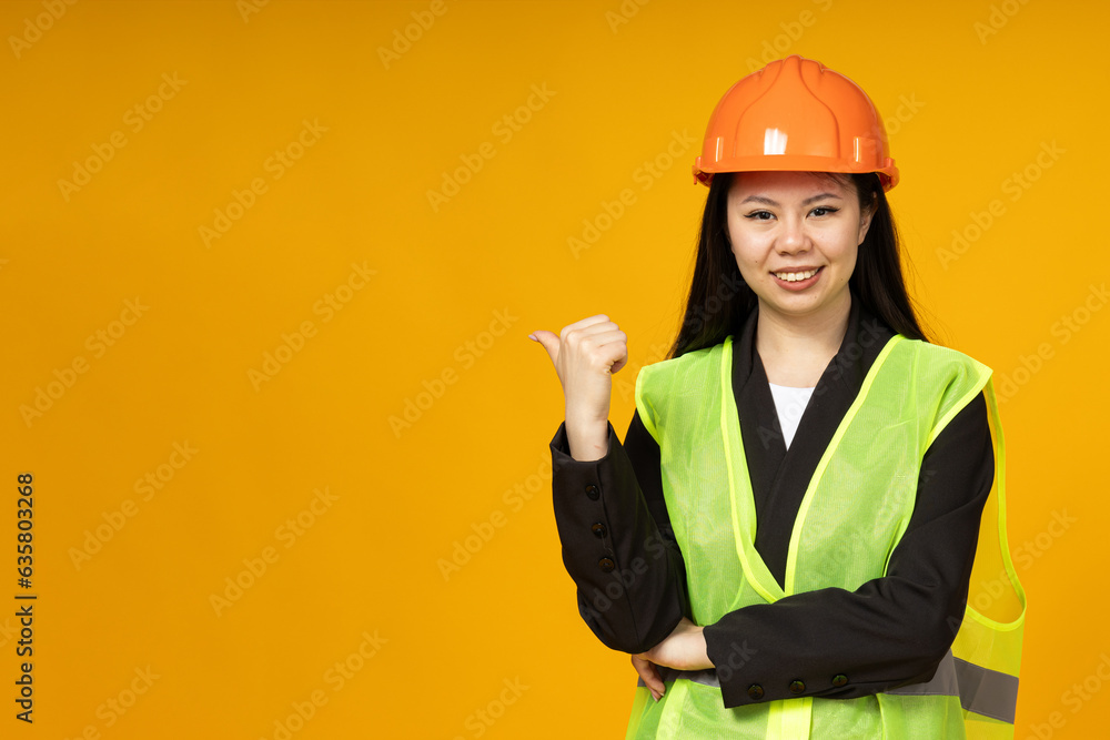 An Asian girl in a bright helmet and vest An Asian girl in a bright helmet and vest