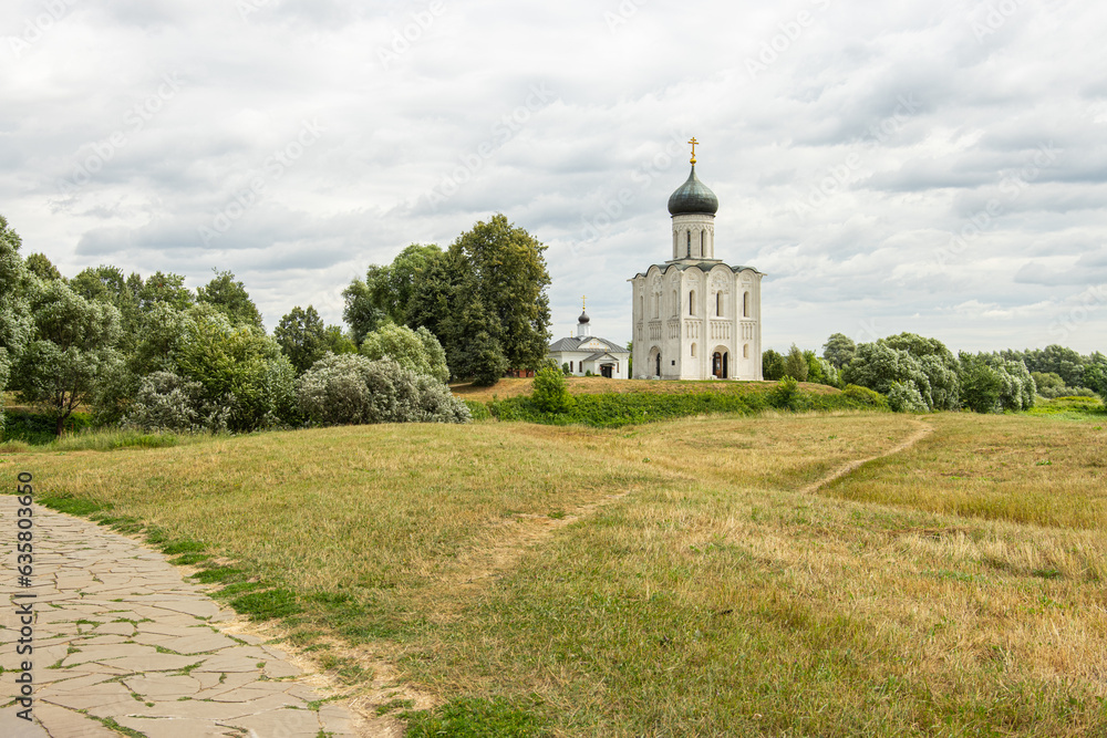 Path in the field leading to the Christian church