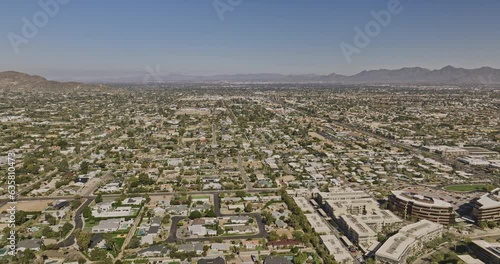 Scottsdale Arizona Aerial v15 drone flyover and around downtown area capturing cityscape of the neighborhoods and panoramic views of desert mountainscape - Shot with Mavic 3 Cine - February 2022 photo