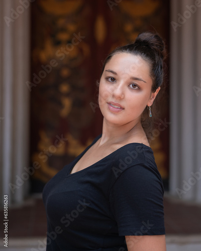 Beautiful Caucasian tourists wearing casual dressed modern black casual clothes post at Wat Pha Lat Temple. Which is an ancient temple in Chiang Mai, Thailand.