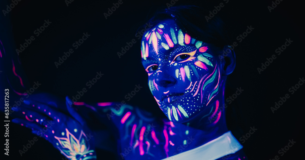 Creative Young Female Covered in Neon Body Paint Performing Modern Dance Choreography in a Studio with Abstract Art Background. Beautiful Contemporary Dancer Expressing Her Inner World Through Dance
