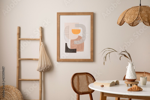 Bilde på lerret Interrior design of stylish dining room with round table, rattan chair, wooden commode, pock up poster and kitchen accessories