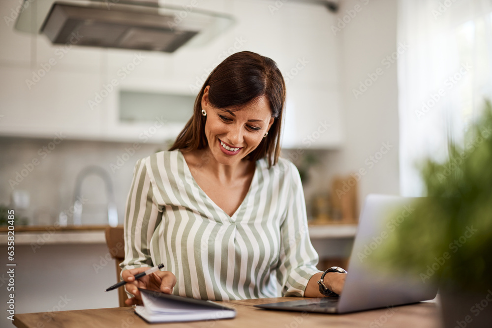 A female entrepreneur with a beautiful smile is working from home in the morning. A female entrepreneur with a beautiful smile is working from home in the morning.
