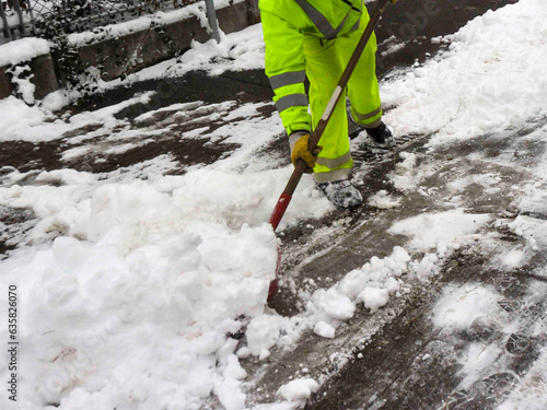 snow removal with snow shovel photo