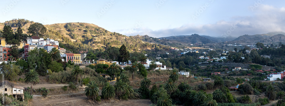 Panoramic photograph of the town of Santa Brígida, enclosed in a beautiful ravine surrounded by palm groves. Gran Canaria, Spain