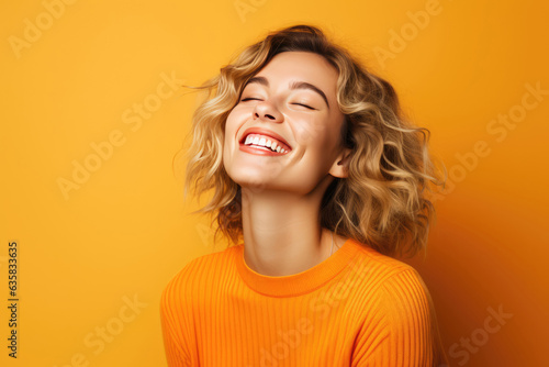 Beautiful Young Happy European Woman On Orange Background