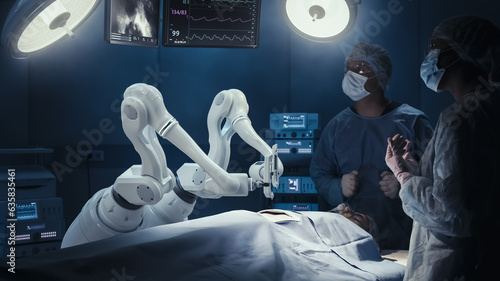Photographie Two Surgeons Observing High-Precision Programmable Automated Robot Arms Operating Patient In High-Tech Hospital