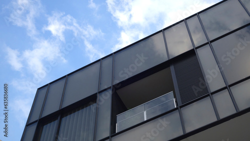 Modern apartment buildings on a sunny day with a blue sky. Facade of a modern glass building