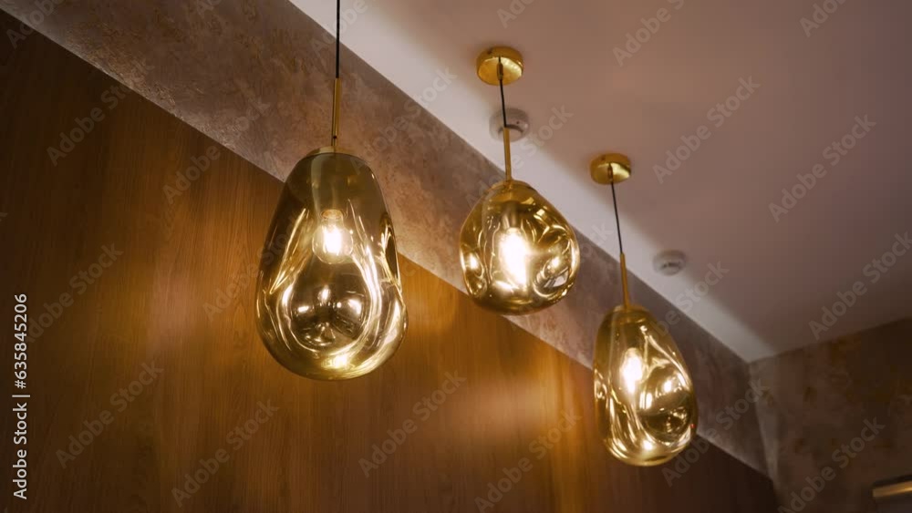 Stylish interior, blurred lights of lamps under the ceiling. Stylish interior, blurred lights of lamps under the ceiling.