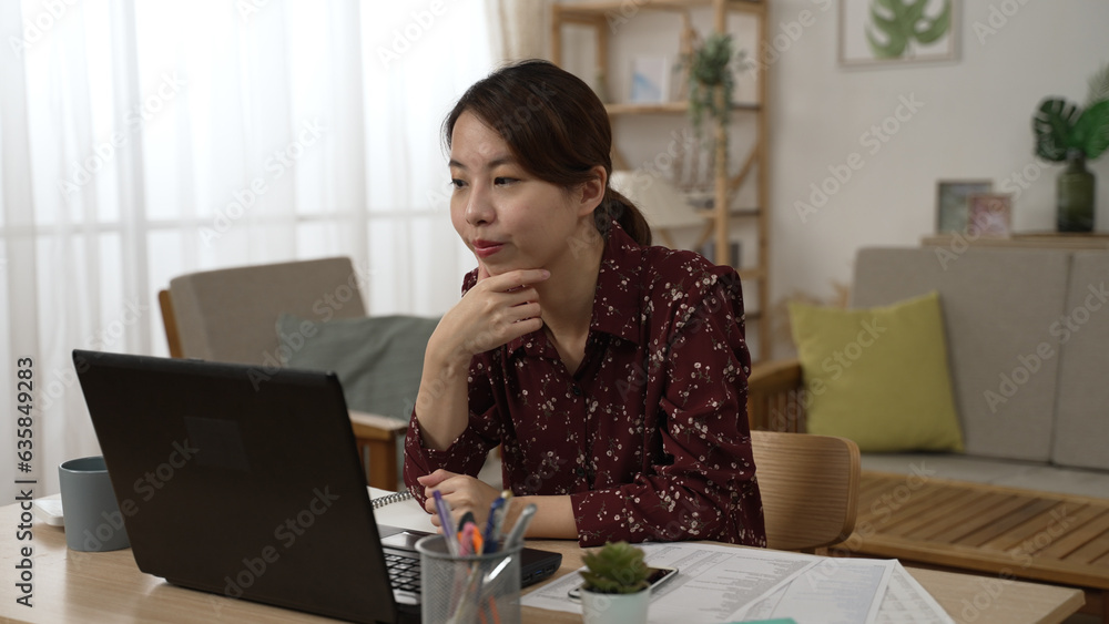 satisfied asian Japanese woman rest at home office during quarantine time sit with laptop. satisfied asian Japanese woman rest at home office during quarantine time sit with laptop.