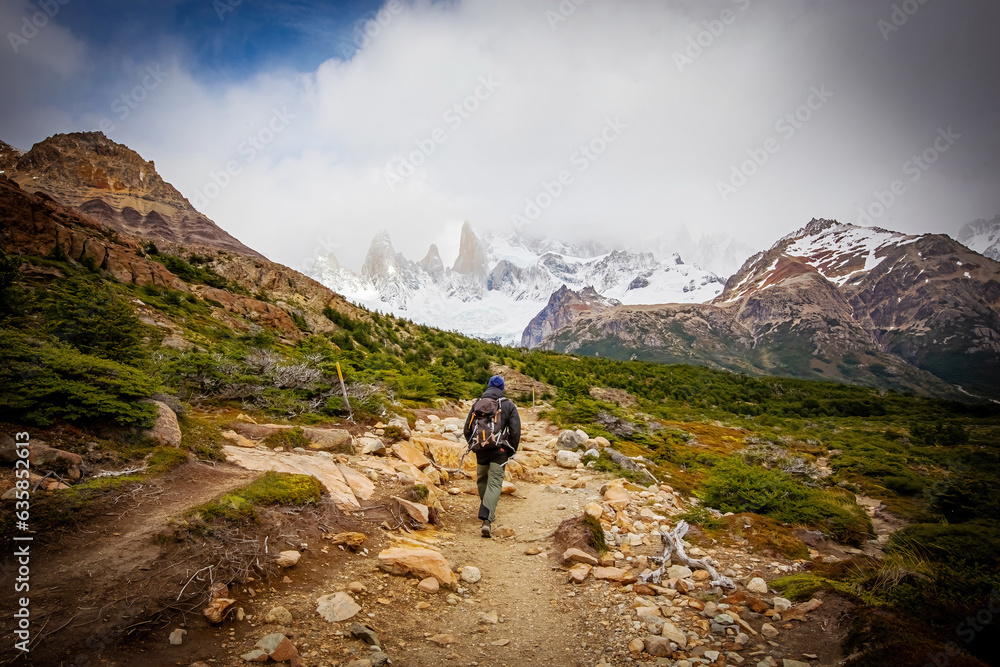 Beautiful nature of Patagonia. Fitz Roy trek, man with backpack walking, view of Andes mountains, Los Glaciers National Park, El Chalten, Argentina