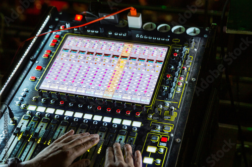 Obraz na płótnie Hands on mixing console in music recording studio
