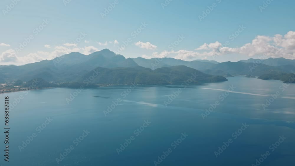 from above view of sea or lake shore with docks and piers, high point of drone fly on sunny day. Amazing aerial landscape high altitude on beautiful town and sea with yahts and boats. blue sky and sea from above view of sea or lake shore with docks and piers, high point of drone fly on sunny day. Amazing aerial landscape high altitude on beautiful town and sea with yahts and boats. blue sky and sea