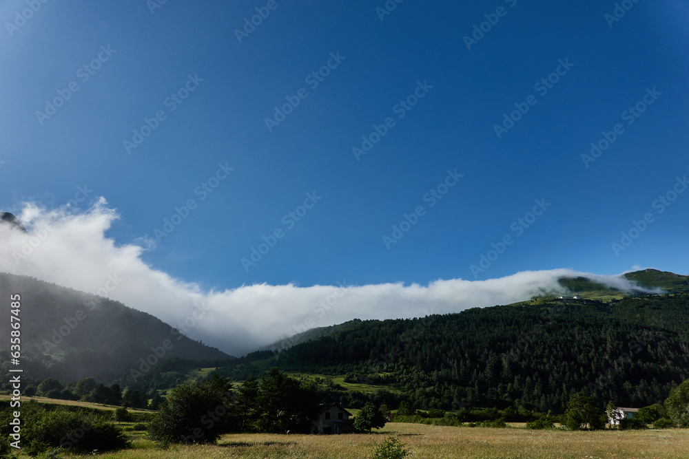 Naklejka premium the area of ​​Larra-Belagua in the Pyrenees, on the way to La Piedra de San Martin, where fog usually makes an appearance. Navarre. Spain