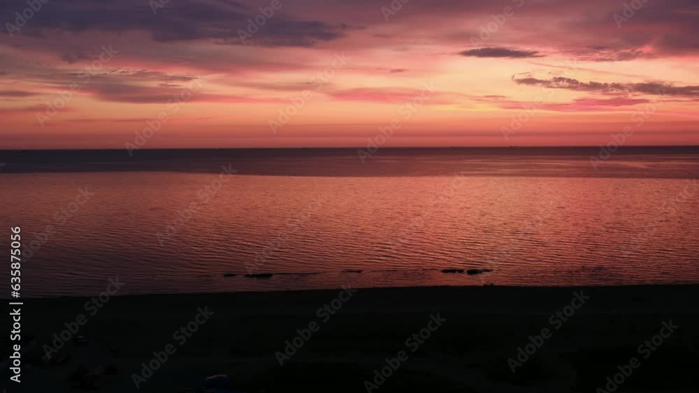 Colorful sea beach sunrise with deep pink yellow sky and sunshine. Colorful sea beach sunrise with deep pink yellow sky and sunshine.