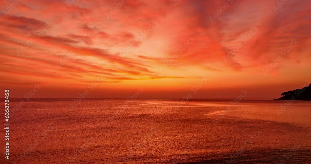 .aerial view exotic colorful red sky in bright sunset above the ocean..Scene of colorful romantic sky of sunset. Gradient color Sky texture..amazing light through to sky at red sunset. .aerial view exotic colorful red sky in bright sunset above the ocean..Scene of colorful romantic sky of sunset. Gradient color Sky texture..amazing light through to sky at red sunset.
