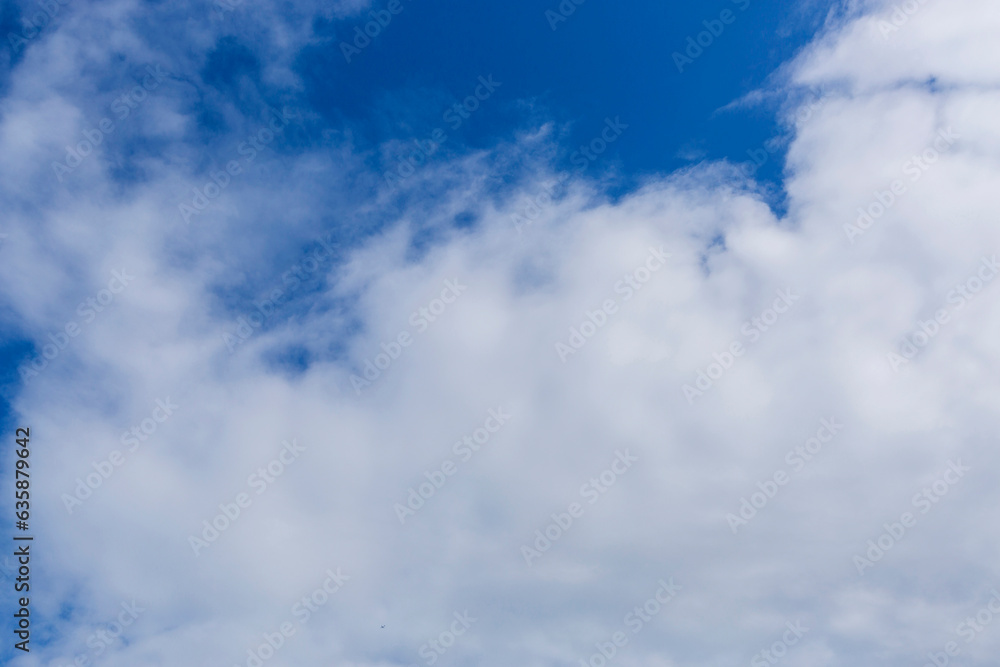White clouds on blue sky, weather concept