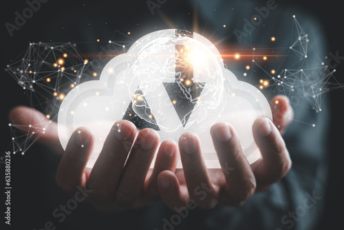 Cloud based Data Exchange, A businessman interacts with a digital dashboard, representing integration of cloud technology and metaverse systems. global network enables efficient information sharing.