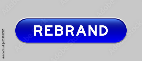 Blue color capsule shape button with word rebrand on gray background