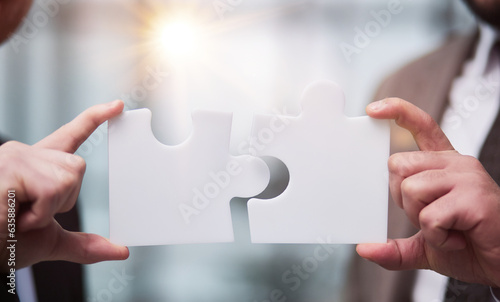 Partnership concept with hands putting jigsaw pieces together