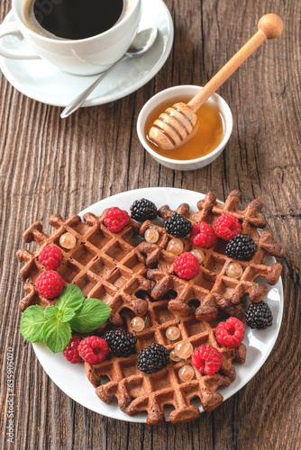 Viennese waffles with raspberries and blackberries for breakfast.