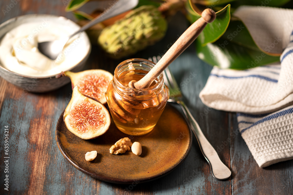 Delicious Greek honey from Rhodes with figs and bowl of yogurt Delicious Greek honey from Rhodes with figs and bowl of yogurt