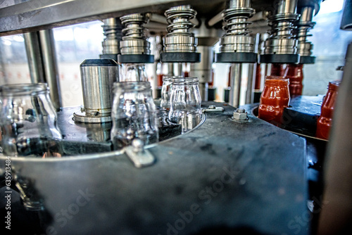The working process of production of tomatoes to canned food and vegetable factory. Workers on the production of canned food. Processing tomato. Sicily Italy.