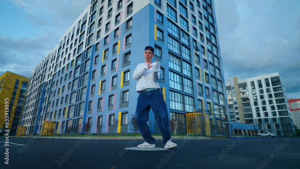 Young Man Dancing Modern Street Dance In Urban Landscape, Contemporary Dance Performance Young Man Dancing Modern Street Dance In Urban Landscape, Contemporary Dance Performance