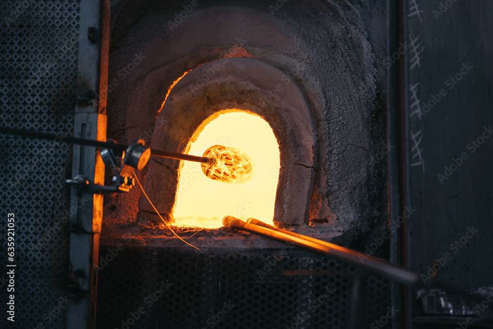 kiln ready to fire glass with glassblower at Stock Photo