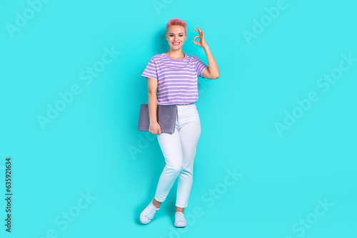 Full length photo of young business lady wearing trendy purple t shirt office manager show okey symbol isolated on blue color background © deagreez