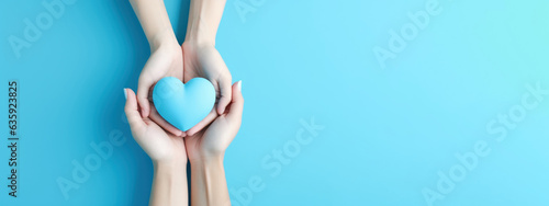 Hand holding blue heart, World health day, Health care and mental health concept, Health insurance, Charity volunteer donation, CSR responsibility, World heart day, Self love photo