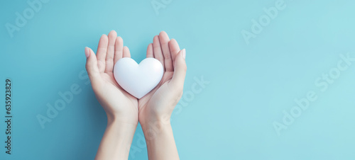 Hand holding white heart, World health day, Health care and mental health concept, Health insurance, Charity volunteer donation, CSR responsibility, World heart day, Self love