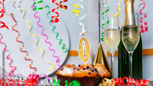 Solemn cake for an anniversary with a number  0. Happy birthday background with champagne bottle and champagne glasses. Beautiful holiday decorations copy space. photo