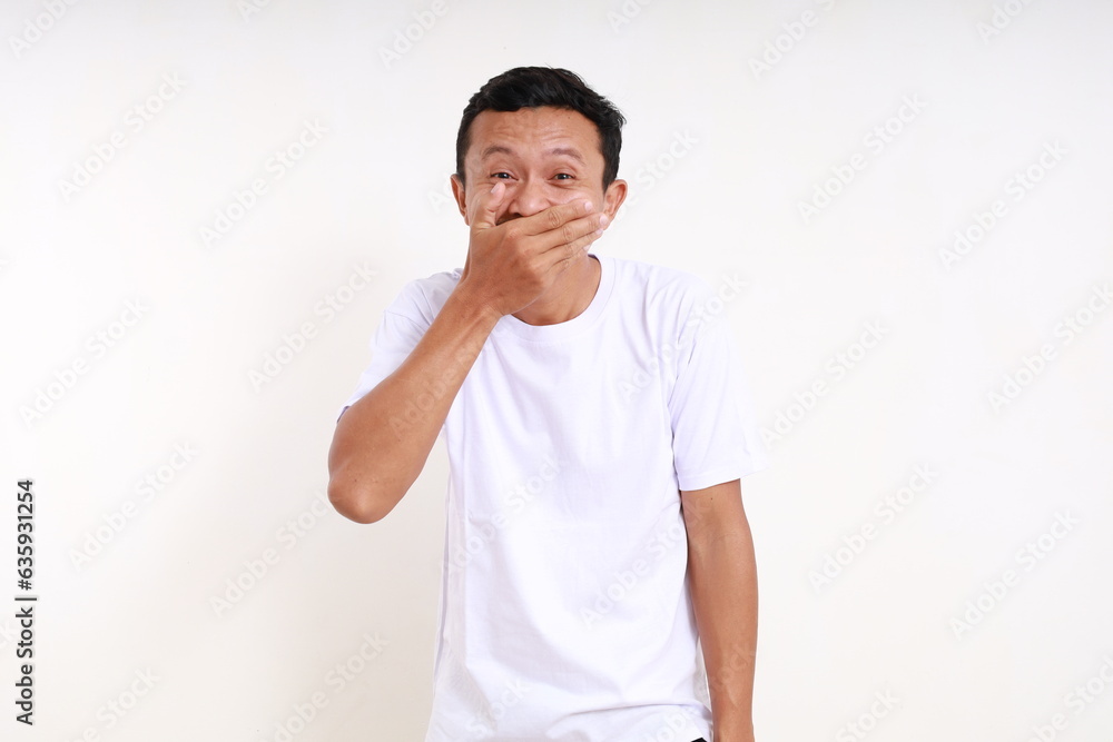 Asian funny man covering his mouth. Ups gesture. Isolated on white background Asian funny man covering his mouth. Ups gesture. Isolated on white background