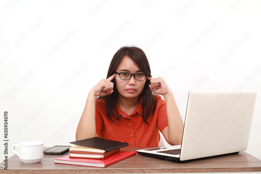 Confused young asian entrepreneur woman thinking something while looking at the camera Confused young asian entrepreneur woman thinking something while looking at the camera