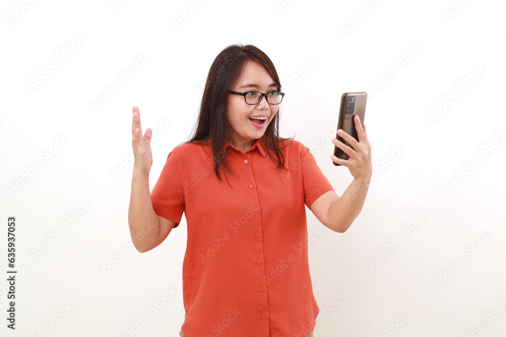 Wow expression of young asian woman getting good news from her phone. Isolated on white Wow expression of young asian woman getting good news from her phone. Isolated on white