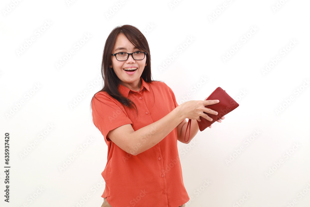 Obraz premium Happy excited asian woman standing while holding her wallet. Shopping concept