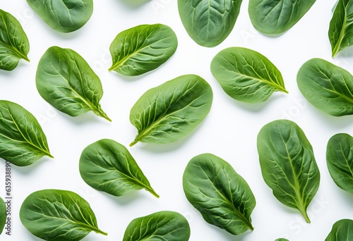 fresh spinach leaves on white background © alexxndr