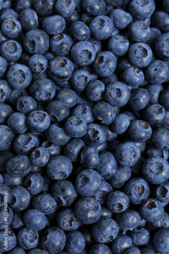 Картината върху платно Tasty fresh blueberries as background, top view