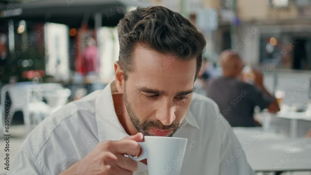 Thoughtful businessman drinking coffee in cafeteria closeup. Gentleman at cafe Thoughtful businessman drinking coffee in cafeteria closeup. Gentleman at cafe