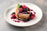 Pancake with mix berry on white dish