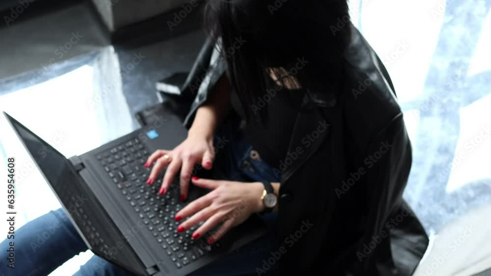 Copywriter girl typing on a laptop keyboard Copywriter girl typing on a laptop keyboard