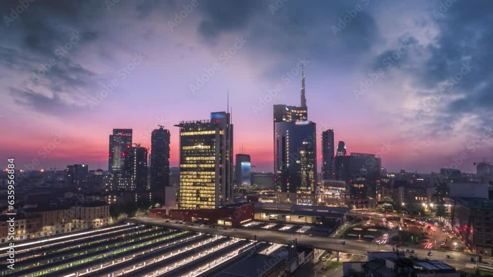 Milan skyline aerial view time lapse from day to night, milano skyline panoramic view.Milan Italy night skyscrapers business district.Milano italy city. Milan skyline aerial view time lapse from day to night, milano skyline panoramic view.Milan Italy night skyscrapers business district.Milano italy city.