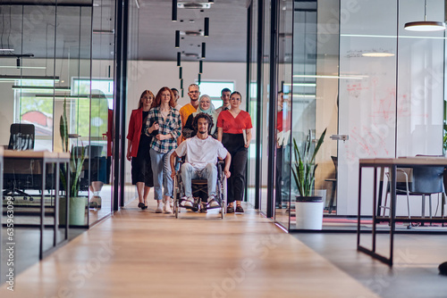 A diverse group of young business people congregates within a modern startup's glass-enclosed office, featuring inclusivity with a person in a wheelchair, an African American young man , and a hijab